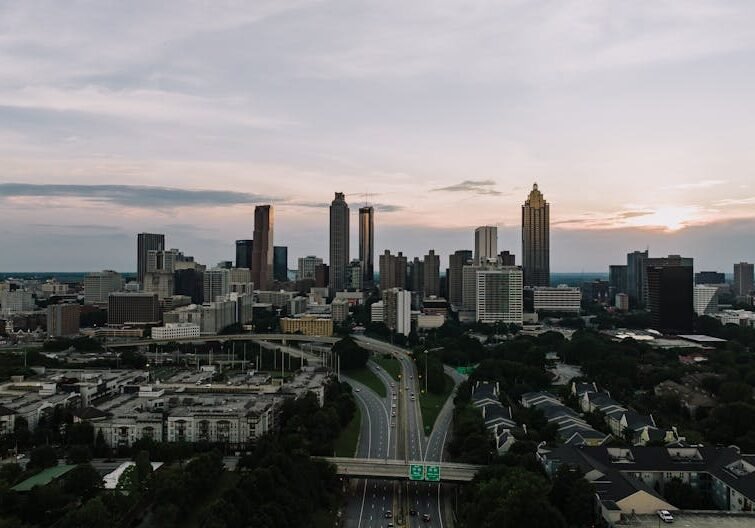 Atlanta skyline with I-85 and I-75 connector at dusk, personal injury legal representation - hire atlanta accident attorney
